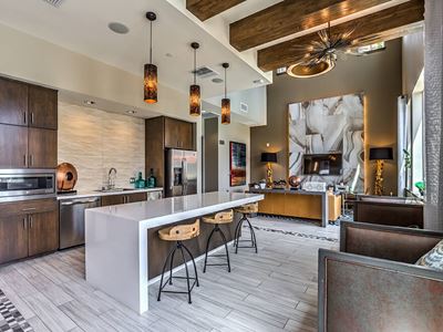 Eat-In Table With High Chairs In Clubhouse at Miro Apartments, Santa Fe Springs, California
